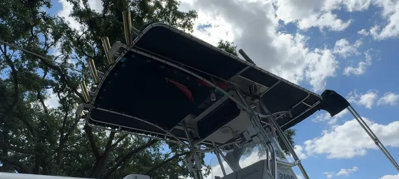 Slide: The Image of Triton 2690 CC boat canopy against a cloudy sky, 2003 model. - 8