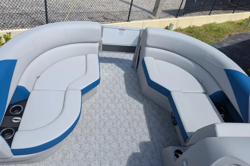 Slide: The Image of Luxurious seating on 2026 Trifecta 22TRFC LE pontoon boat with blue and gray upholstery. - 9
