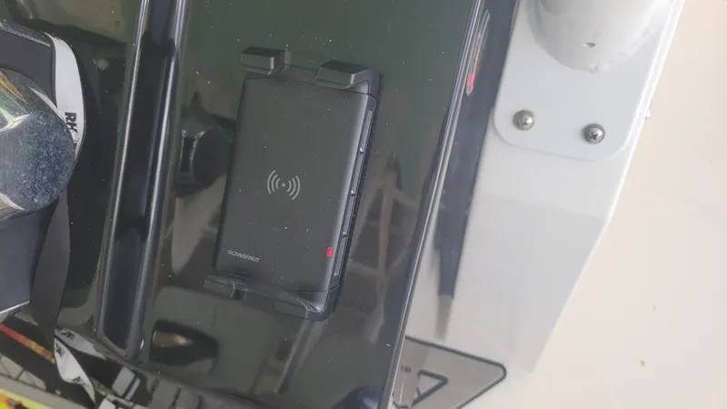 Slide: The Image of 2023 Wellcraft 352 Fisherman dashboard with wireless charging pad. - 10