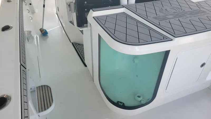 Slide: The Image of 2023 Wellcraft 352 Fisherman boat interior with storage and seating area. - 21