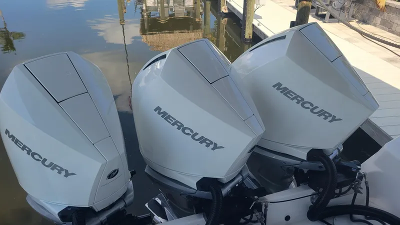 Slide: The Image of Triple Mercury outboard engines on a 2023 Wellcraft 352 Fisherman boat. - 31