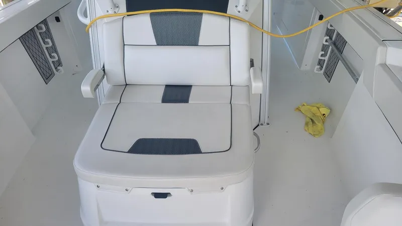 Slide: The Image of 2023 Wellcraft 352 Fisherman boat interior with cushioned seating and storage compartments. - 36