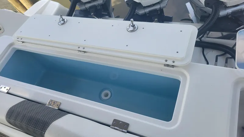 Slide: The Image of 2023 Wellcraft 352 Fisherman boat with open storage compartment. - 41