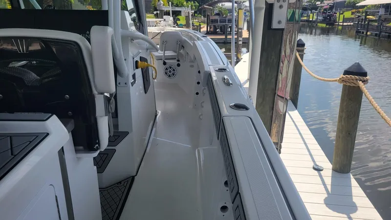 Slide: The Image of 2023 Wellcraft 352 Fisherman boat docked, showcasing sleek interior and modern design. - 42