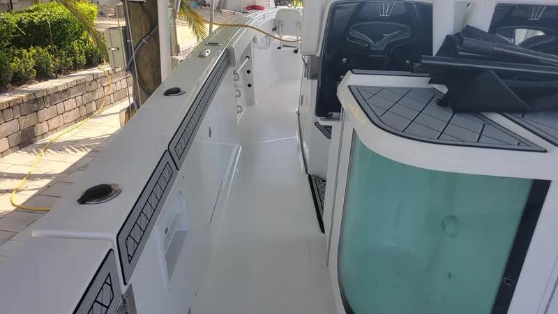 Slide: The Image of 2023 Wellcraft 352 Fisherman boat deck with modern design and seating area. - 43