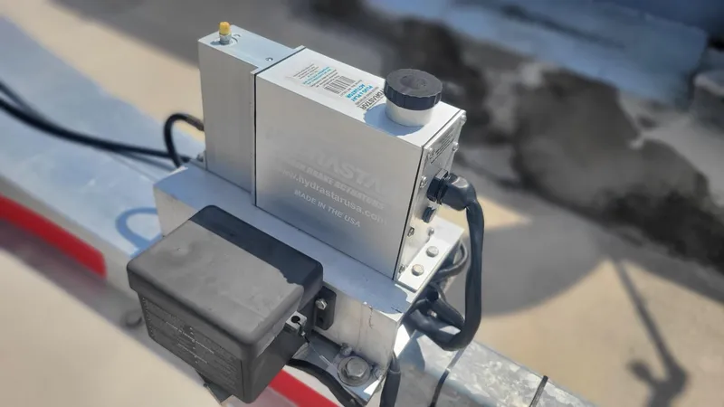 Slide: The Image of Close-up of a 2023 Wellcraft 352 Fisherman boat component on a metal surface. - 45