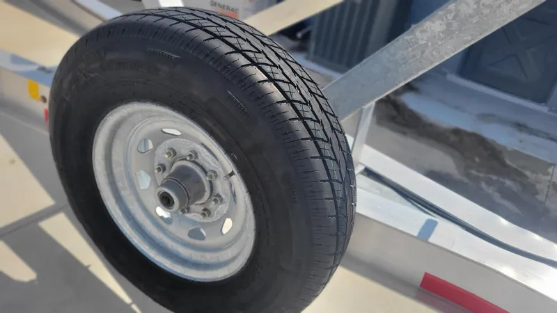 Slide: The Image of Trailer wheel for 2023 Wellcraft 352 Fisherman boat, close-up view. - 46