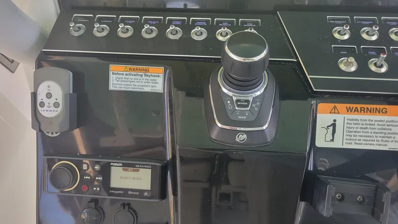 Slide: The Image of Control panel of 2023 Wellcraft 352 Fisherman boat with switches and joystick. - 9