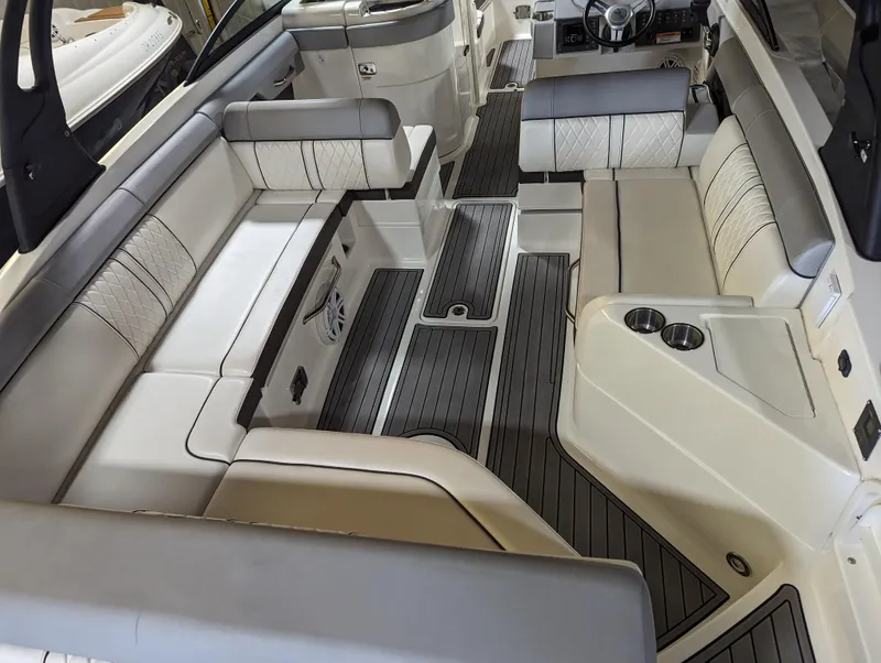 Slide: The Image of 2017 Sea Ray SDX 270 boat interior with spacious seating and modern design. - 11