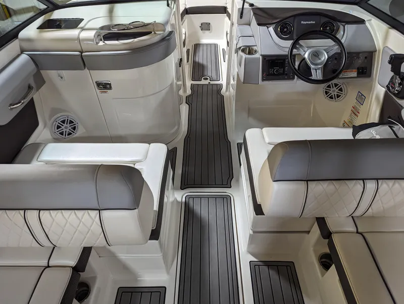 Slide: The Image of 2017 Sea Ray SDX 270 boat interior with luxurious seating and modern dashboard design. - 12