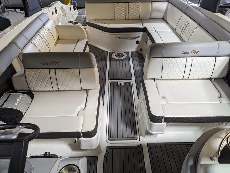 Slide: The Image of Interior of 2017 Sea Ray SDX 270 boat with luxurious seating and sleek design. - 17