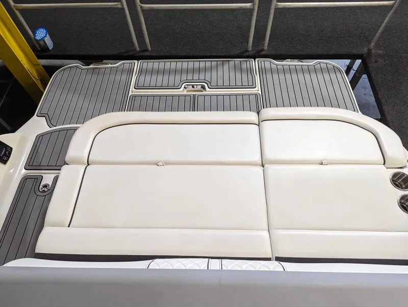 Slide: The Image of 2017 Sea Ray SDX 270 boat interior with cushioned seating and sleek flooring design. - 22