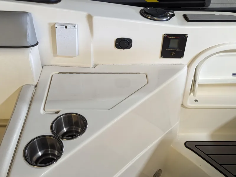 Slide: The Image of Interior of 2017 Sea Ray SDX 270 boat with cup holders and control panel. - 23
