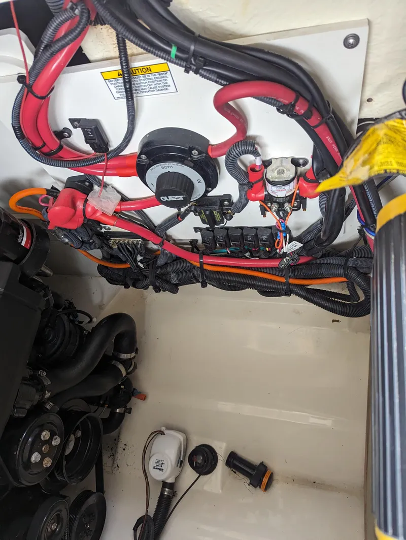 Slide: The Image of Engine compartment of 2017 Sea Ray SDX 270 with wiring and components visible. - 29