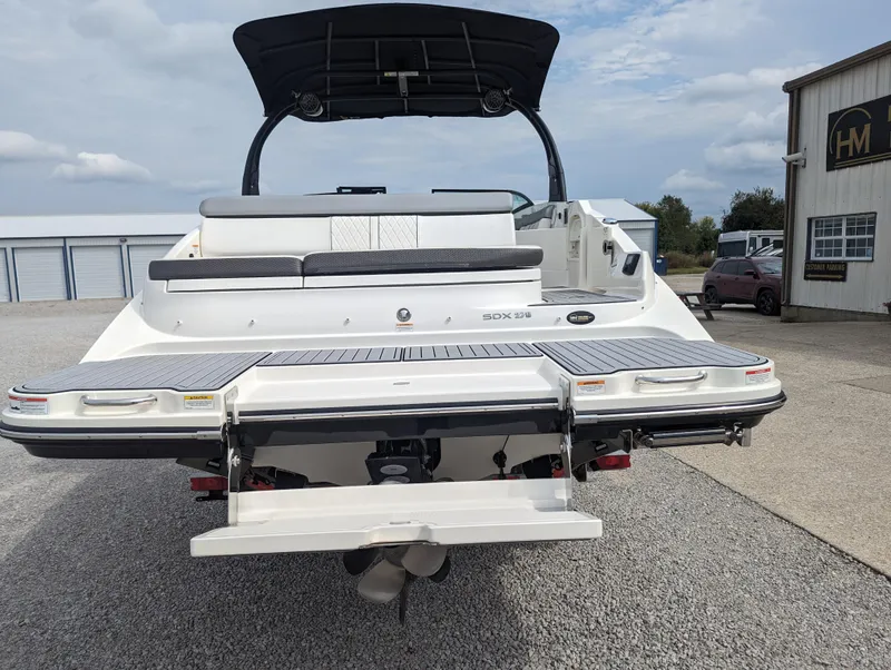 Slide: The Image of 2017 Sea Ray SDX 270 boat rear view with swim platform and seating. - 5