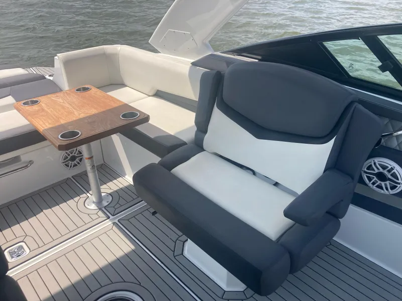 Slide: The Image of 2019 Cruisers Yachts 338 interior with seating and table on deck. - 12