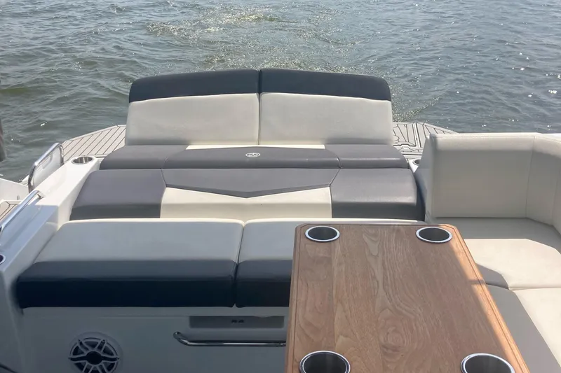 Slide: The Image of 2019 Cruisers Yachts 338 interior with seating and table on water. - 9