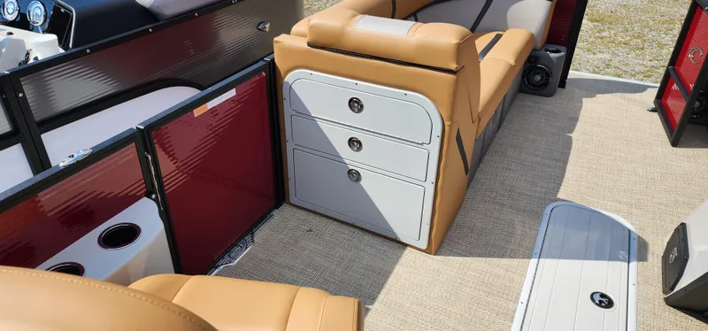 Slide: The Image of 2025 Crest CLASSIC 220 SLC boat interior with tan seating and storage compartments. - 6