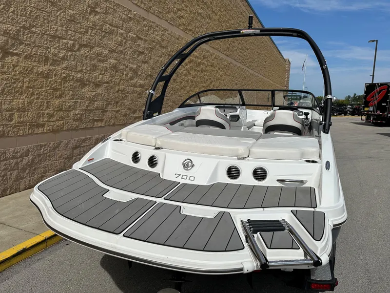 Slide: The Image of 2021 Tahoe 700 boat with sleek design and spacious seating. - 3