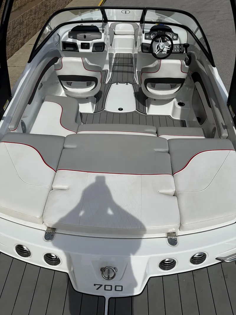 Slide: The Image of 2021 Tahoe 700 boat interior with sleek seating and modern dashboard design. - 5