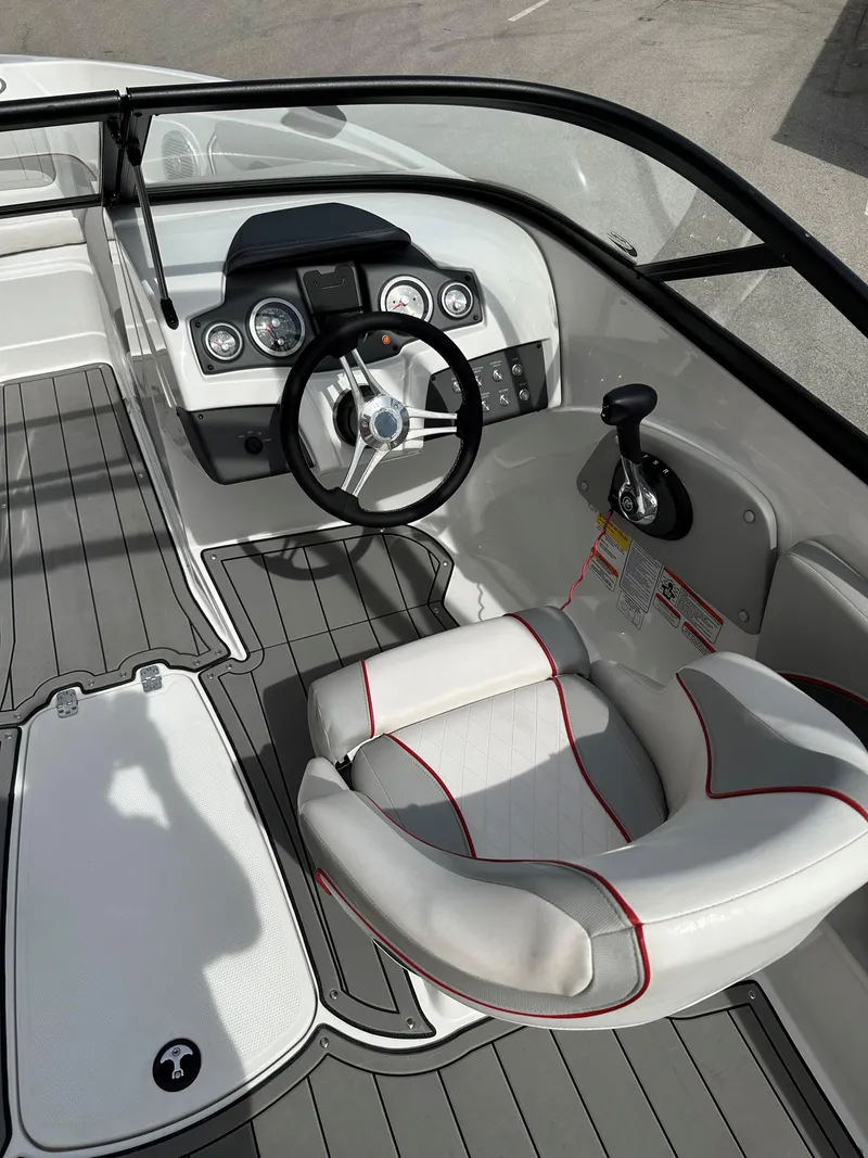 Slide: The Image of 2021 Tahoe 700 boat interior with steering wheel and seating. - 6