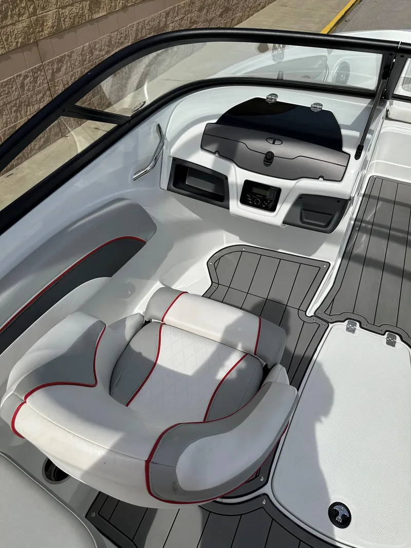 Slide: The Image of 2021 Tahoe 700 boat interior with sleek seating and modern dashboard design. - 7