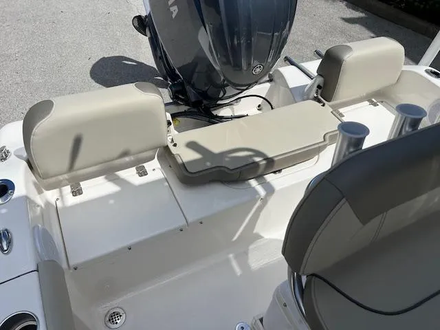 Slide: The Image of 2023 Key West 189 FS boat interior with seating and motor. - 3