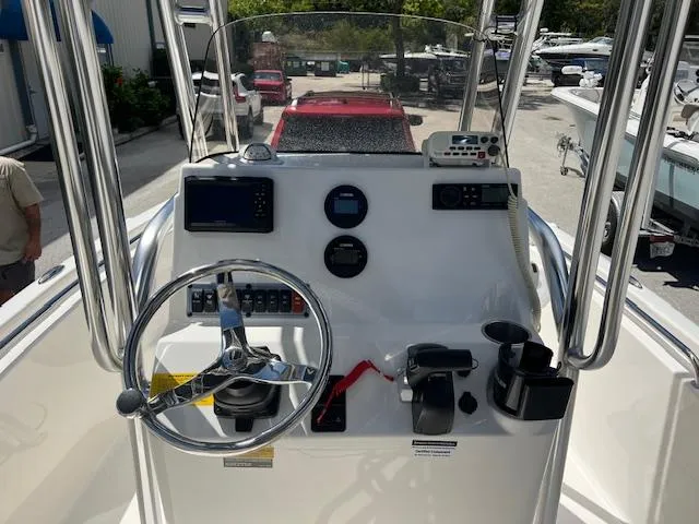 Slide: The Image of 2023 Key West 189 FS boat console with steering wheel and navigation controls. - 5