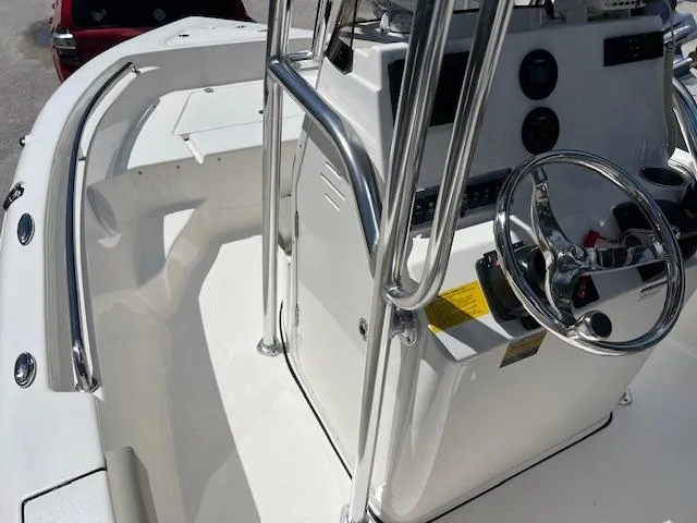 Slide: The Image of 2023 Key West 189 FS boat console with steering wheel and controls. - 6