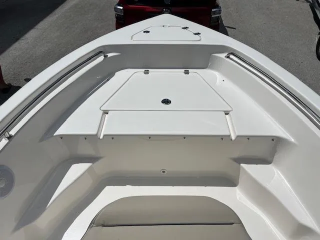 Slide: The Image of 2023 Key West 189 FS boat bow with storage compartment and stainless steel rails. - 8