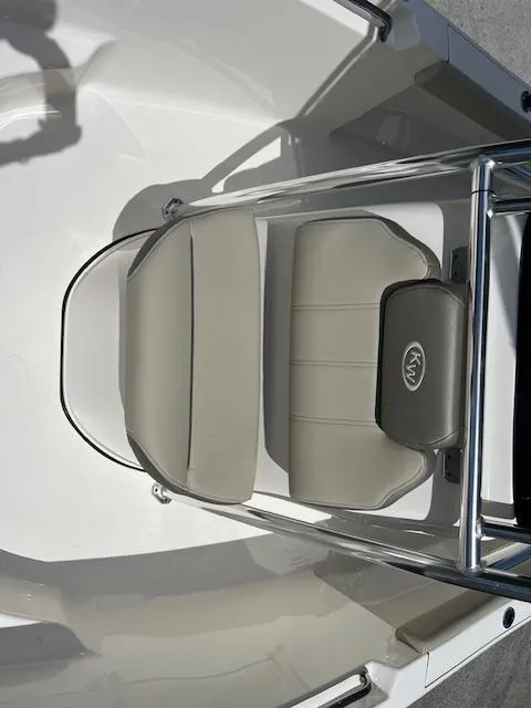 Slide: The Image of 2023 Key West 189 FS boat seat with beige cushions and metal frame. - 9
