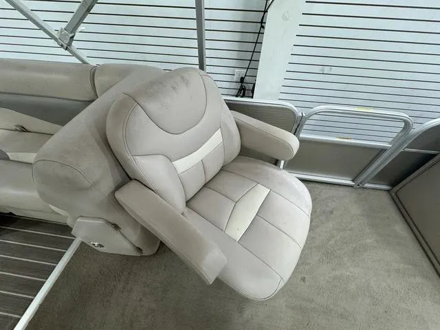 Slide: The Image of 2014 Sweetwater SW 2286 SLC boat seat, beige upholstery, indoor setting. - 12
