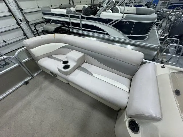 Slide: The Image of 2014 Sweetwater SW 2286 SLC pontoon boat interior with cushioned seating and cup holders. - 15