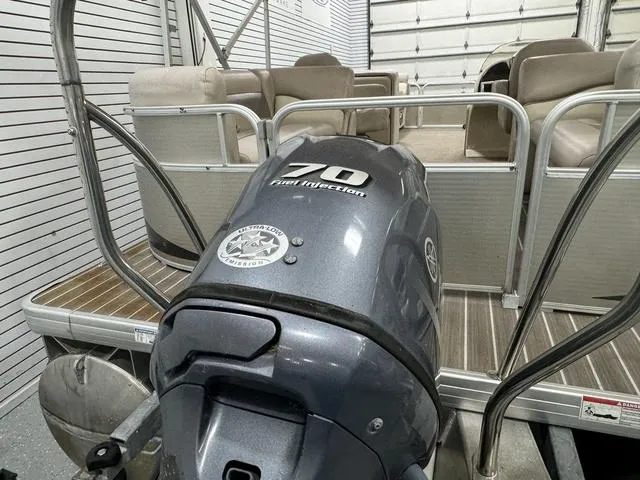 Slide: The Image of 2014 Sweetwater SW 2286 SLC pontoon boat with 70 HP engine in storage. - 20