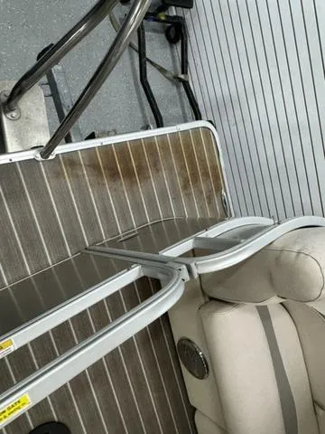 Slide: The Image of 2014 Sweetwater SW 2286 SLC boat interior with seating and flooring details. - 5