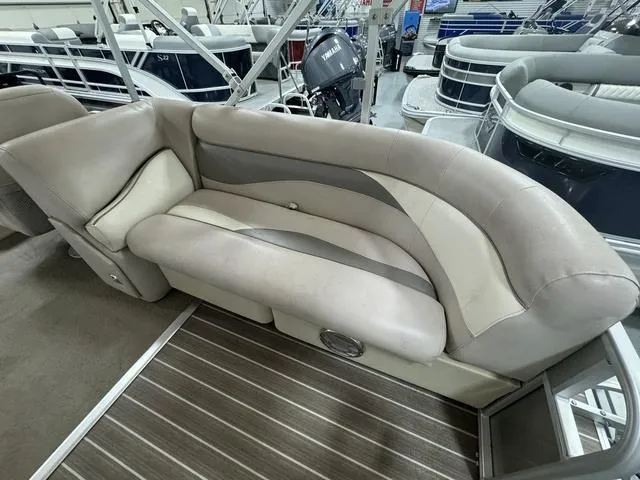 Slide: The Image of 2014 Sweetwater SW 2286 SLC pontoon boat interior with beige seating and striped flooring. - 8