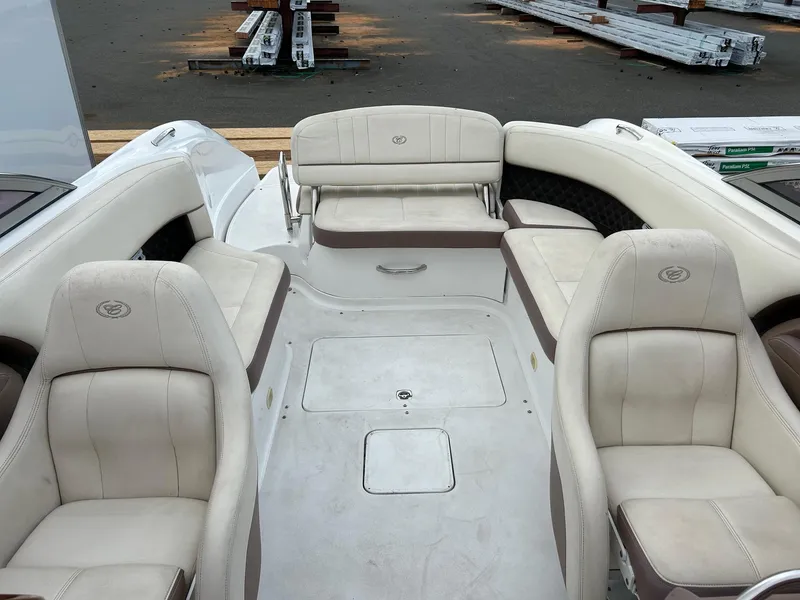 Slide: The Image of 2010 Cobalt 262 boat interior with white leather seating. - 10