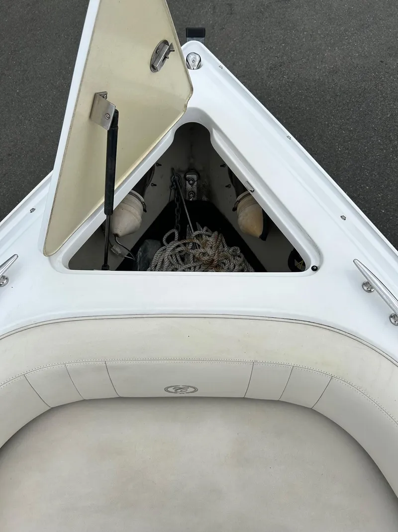 Slide: The Image of Open storage compartment on 2010 Cobalt 262 boat with ropes and equipment. - 3