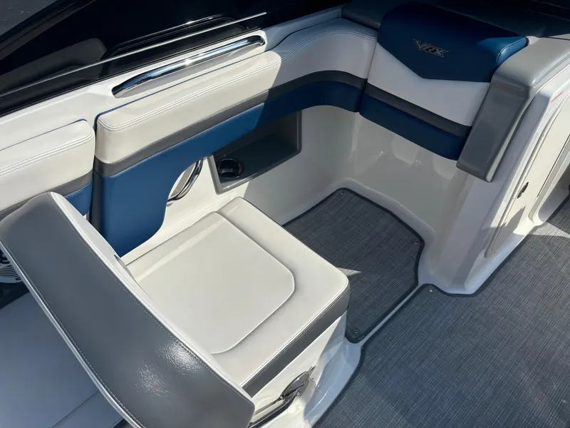 Slide: The Image of 2016 Chaparral Vortex 203 VRX boat interior with blue and white seating. - 1