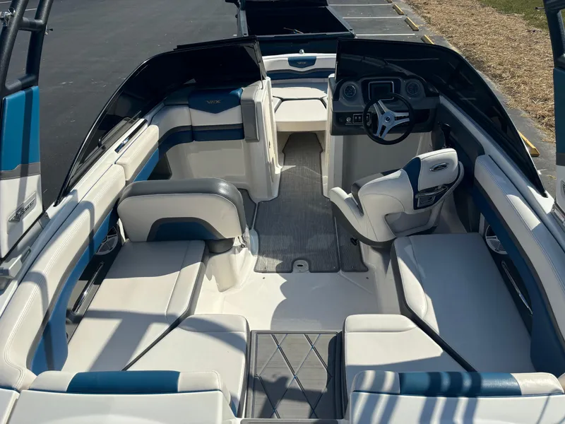 Slide: The Image of 2016 Chaparral Vortex 203 VRX boat interior with white and blue seating. - 10