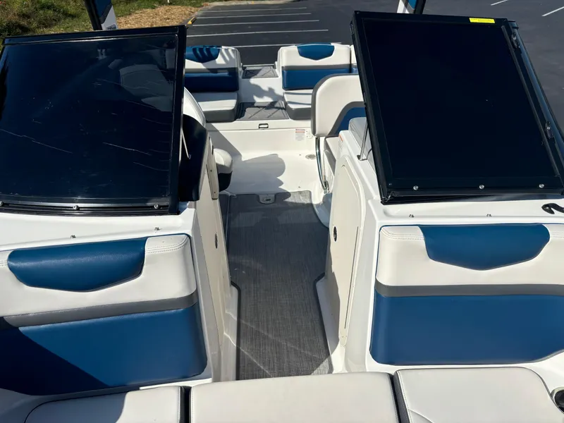 Slide: The Image of 2016 Chaparral Vortex 203 VRX boat interior with blue and white seating. - 12