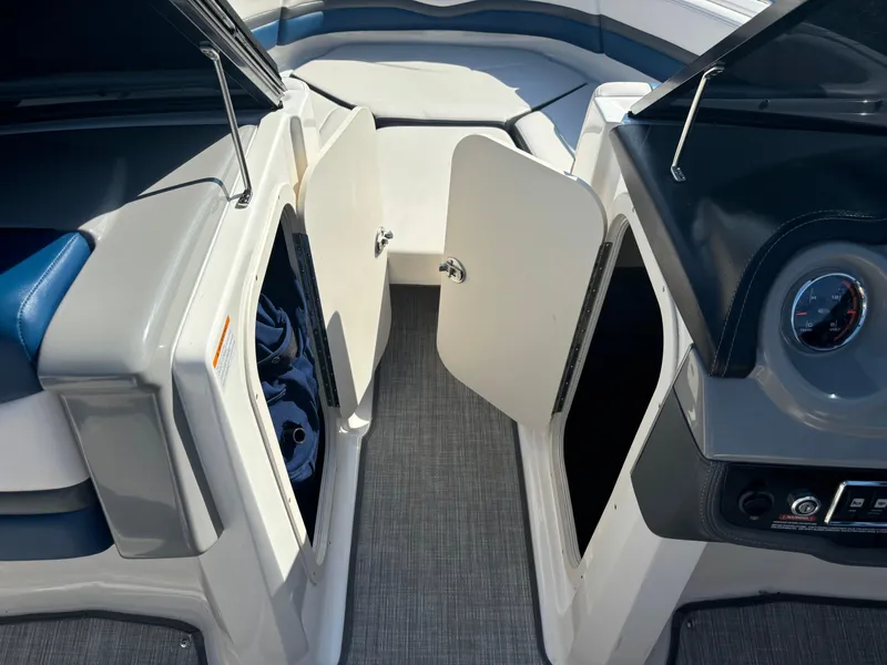 Slide: The Image of 2016 Chaparral Vortex 203 VRX boat interior with open storage compartments. - 13