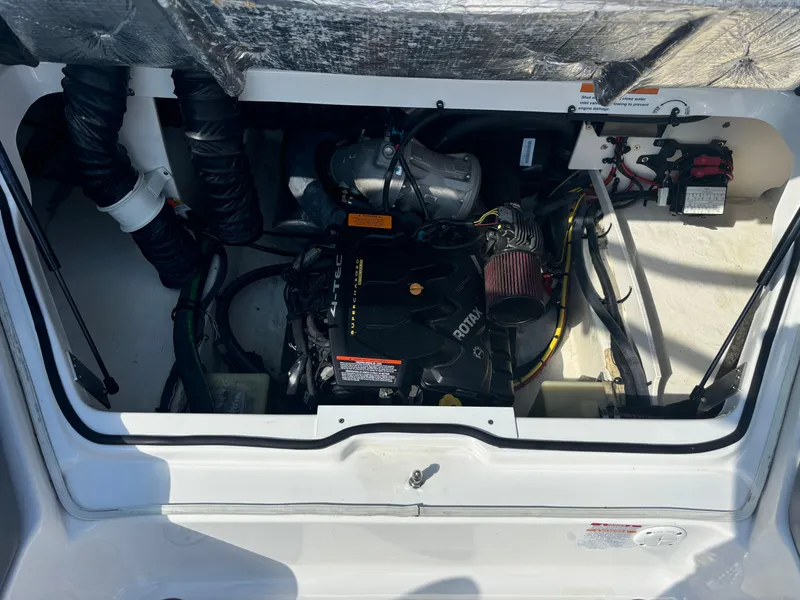 Slide: The Image of Engine compartment of 2016 Chaparral Vortex 203 VRX boat, showcasing Rotax engine components. - 4