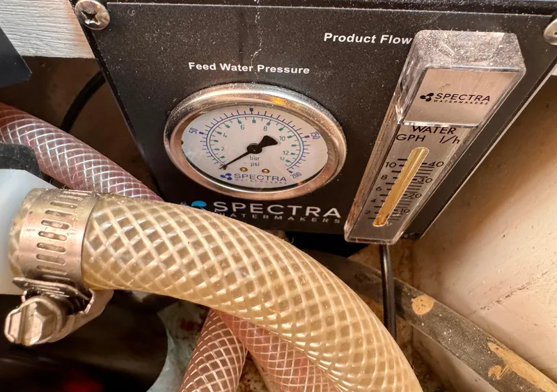 Slide: The Image of Spectra watermaker gauge and hoses on 1983 Tayana 52 Aft Cockpit yacht. - 28