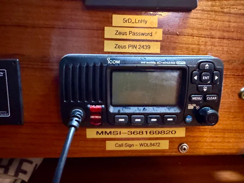 Slide: The Image of VHF marine radio on Tayana 52 Aft Cockpit, 1983, with MMSI and call sign labels. - 31