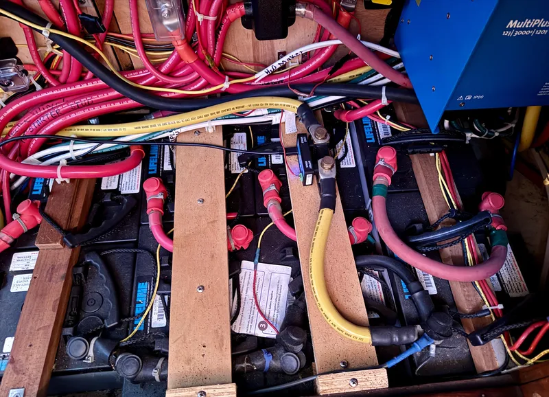 Slide: The Image of Battery compartment of 1983 Tayana 52 Aft Cockpit with wiring and connections. - 37