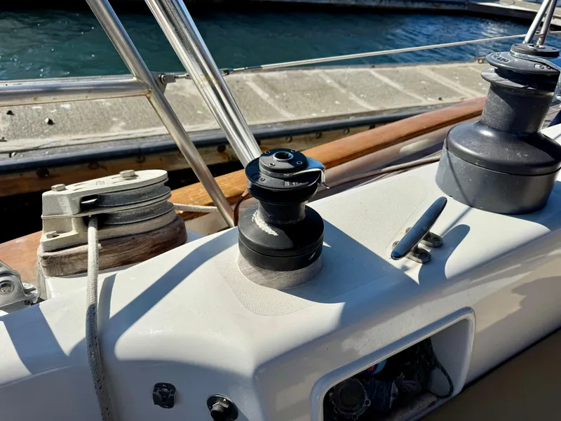Slide: The Image of Deck equipment on 1983 Tayana 52 Aft Cockpit sailboat, featuring winches and railing. - 41