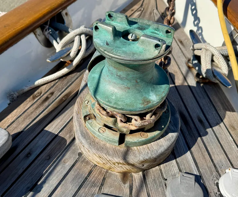 Slide: The Image of Vintage 1983 Tayana 52 Aft Cockpit sailboat winch on wooden deck. - 43