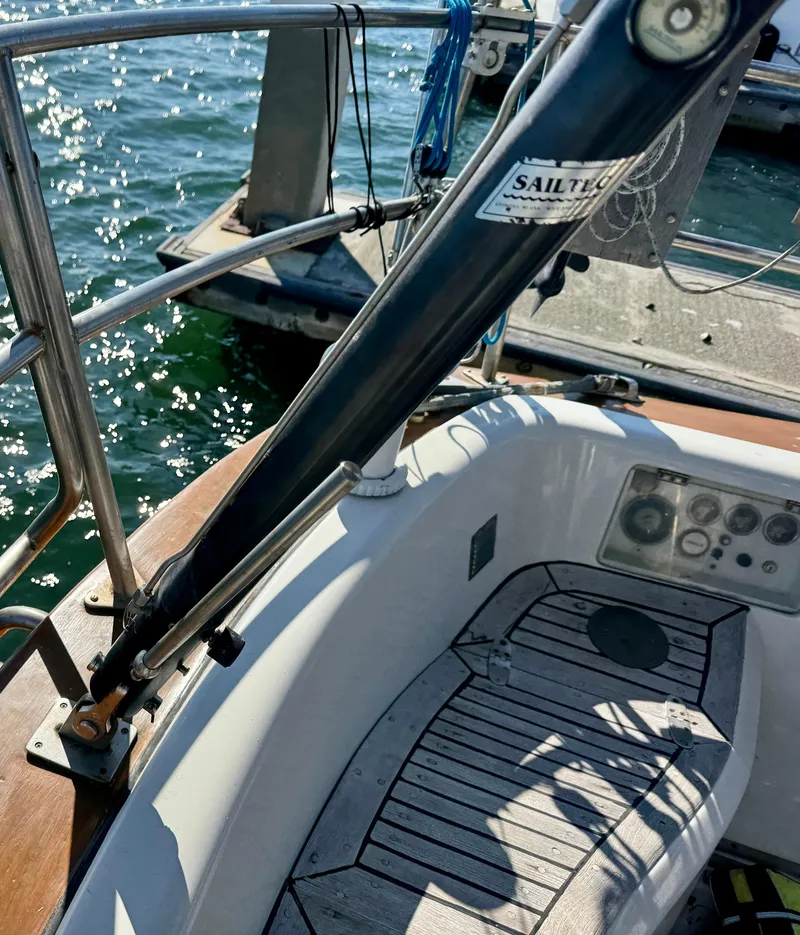 Slide: The Image of 1983 Tayana 52 Aft Cockpit sailboat, docked with visible deck and railing. - 47