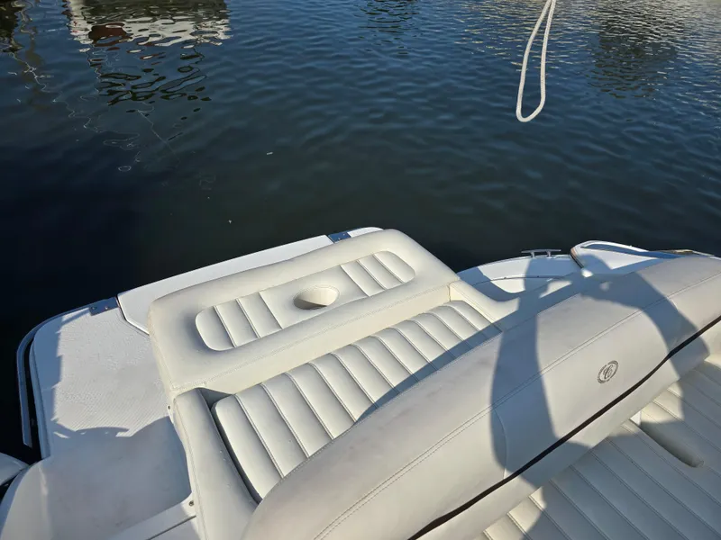 Slide: The Image of 2015 Cobalt R7 boat with white leather seating on calm water. - 4